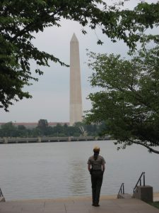 National park ranger looking at Washington Monument
